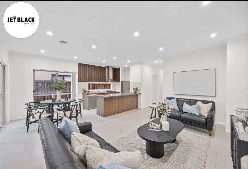 Open plan living room and kitchen interior painted by Jetblack Painting