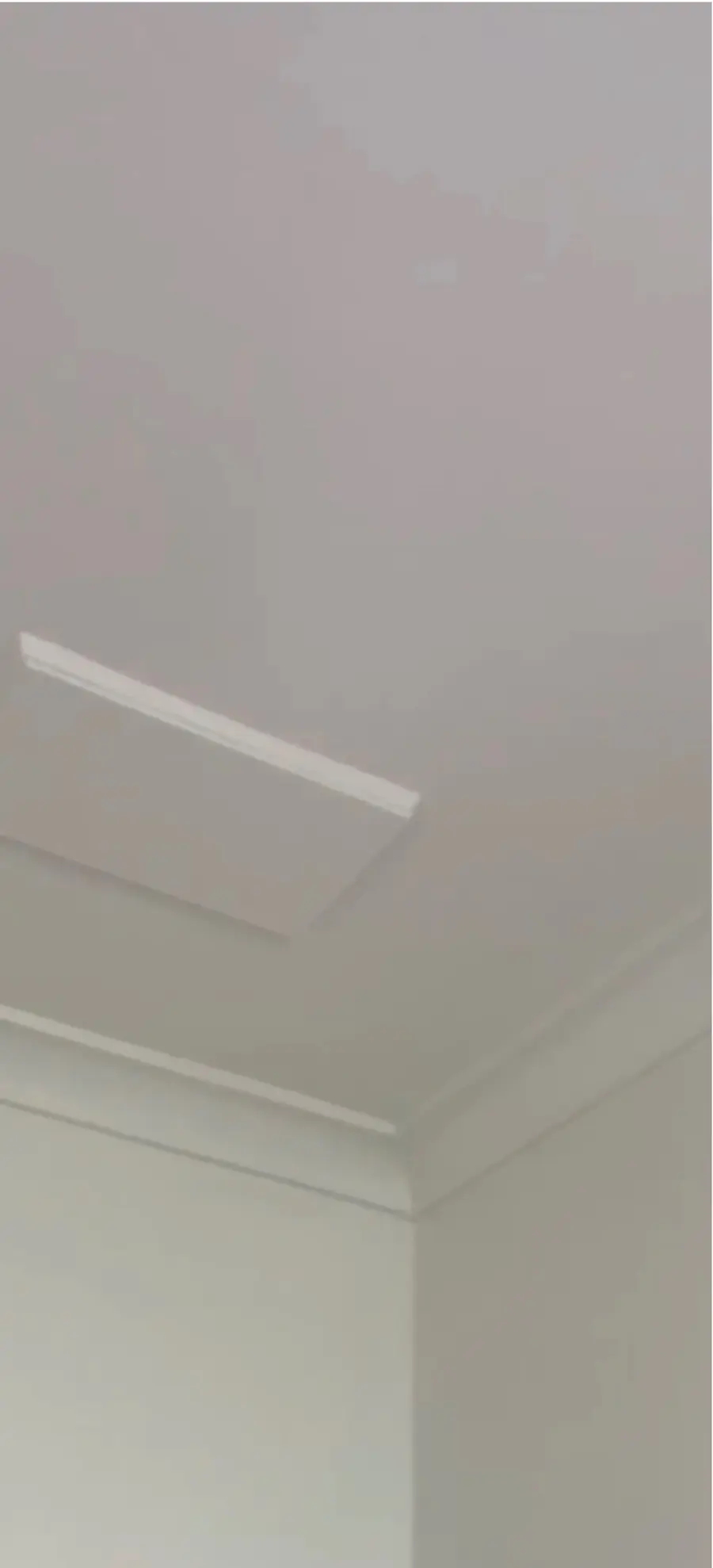 The same ceiling after repair and repainting by Jetblack Painting, smooth and white around the ceiling panel and cornice