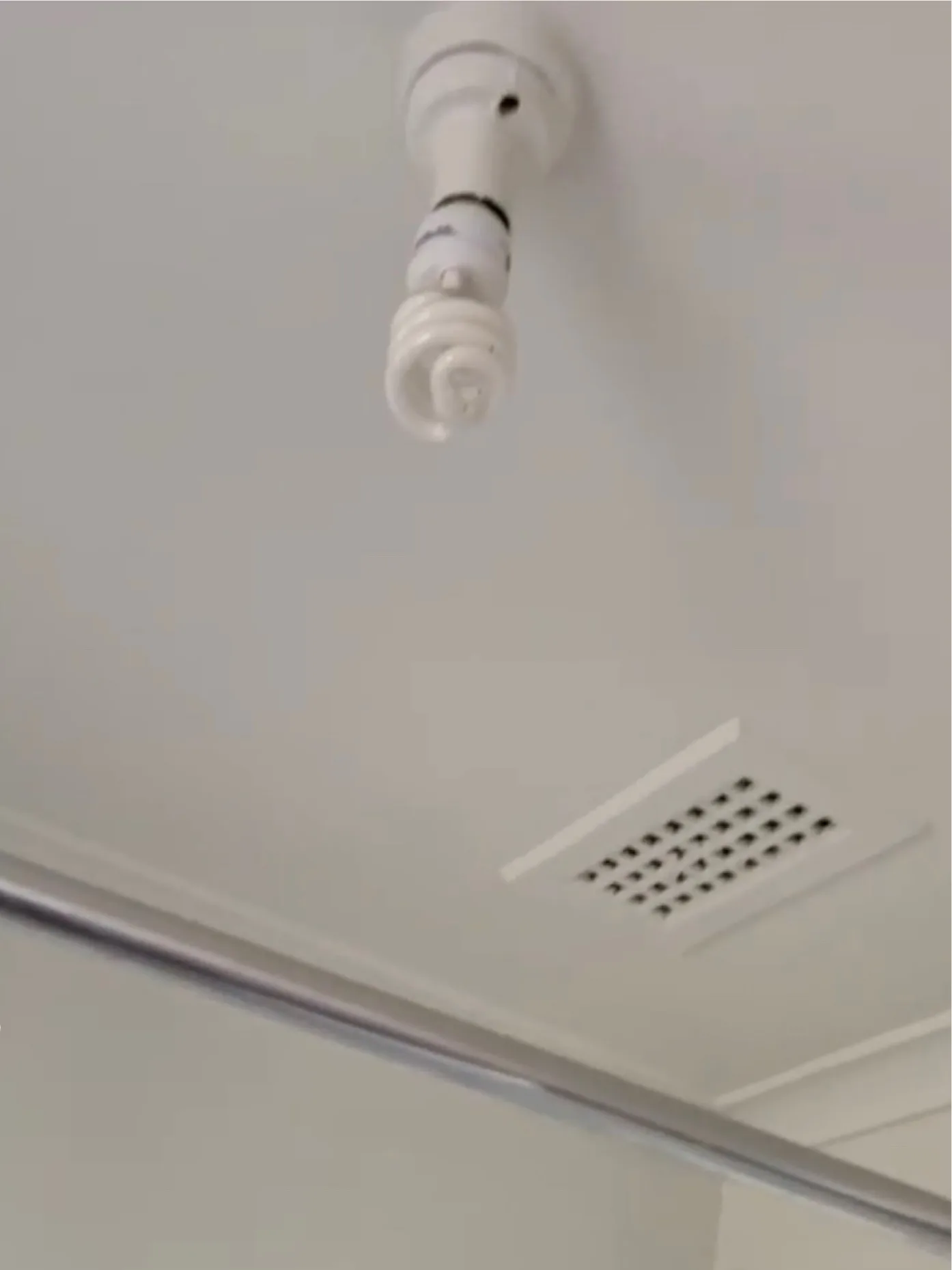 The same Oakleigh bathroom ceiling after mould treatment and repainting by Jetblack Painting, finished clean and white around the exhaust vent