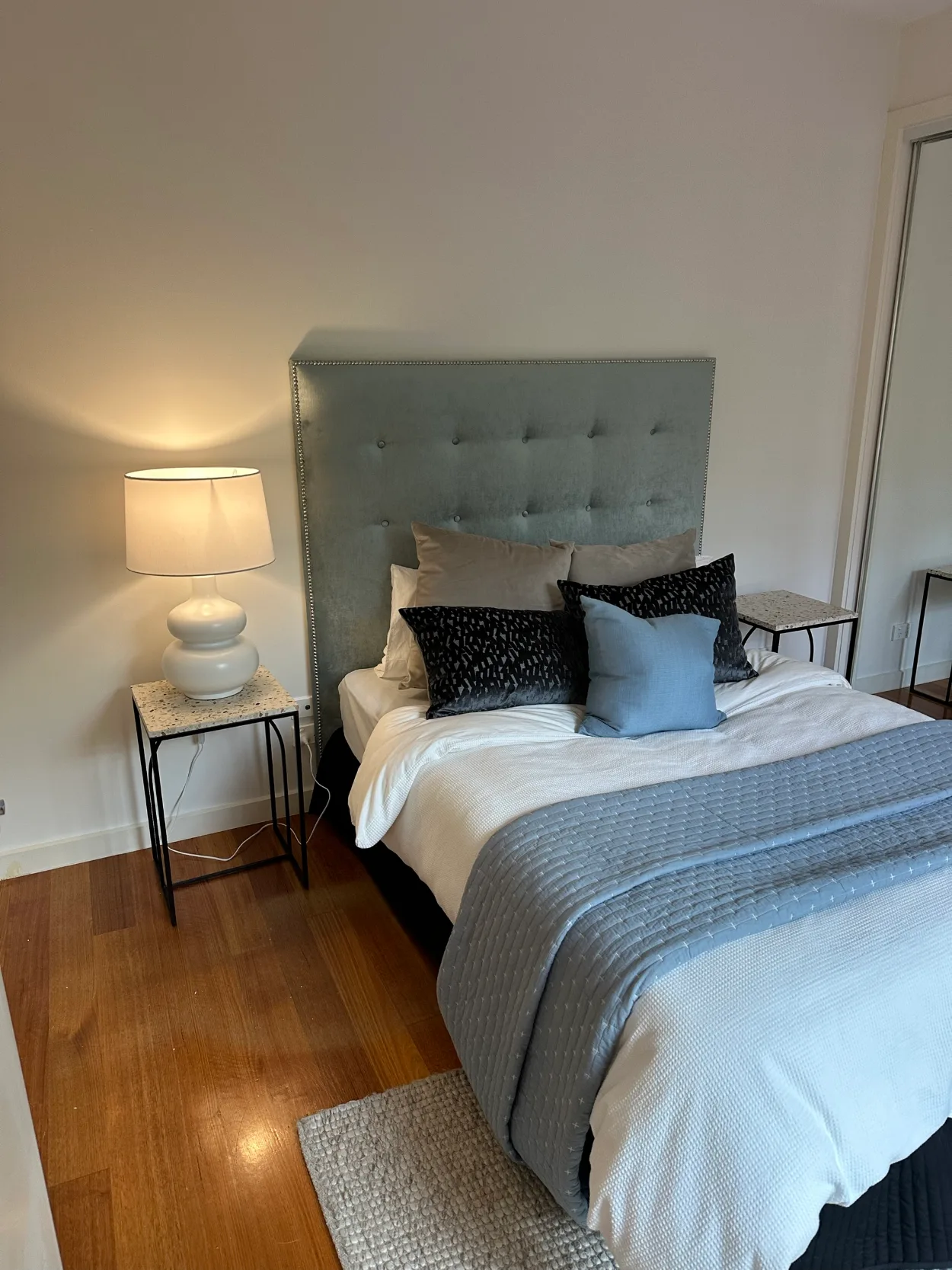 Bedroom in a Aspendale Gardens home after interior painting, with white walls and skirting above timber floorboards