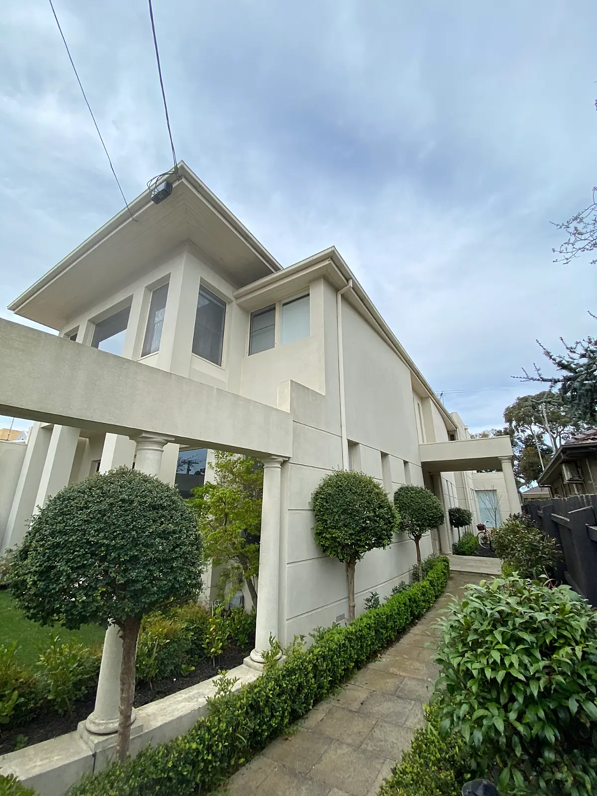 Repainted cream render, columns and eaves on a second Caulfield property