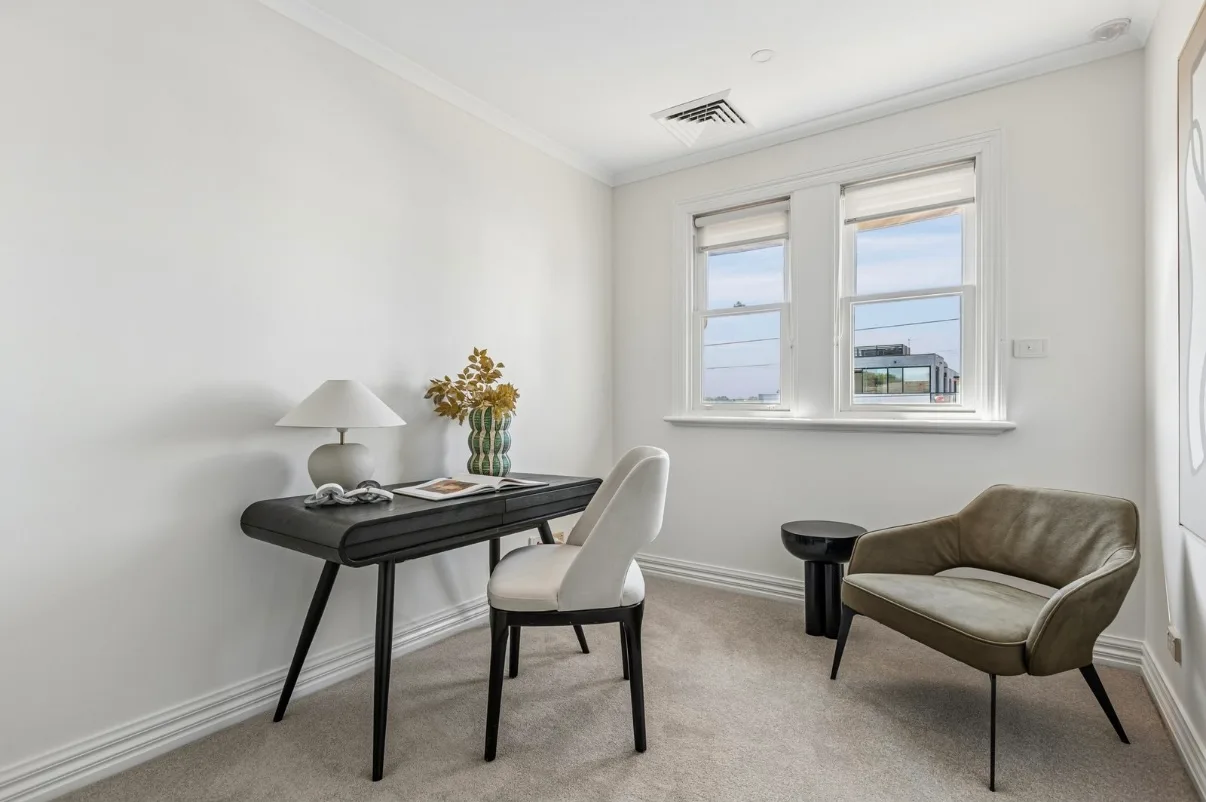 The same Malvern study after the pre-sale repaint, white walls, cornice and window frames